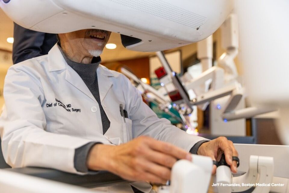 Stanley Tam, MD, a man with facial hair using DV5 robotic technology
