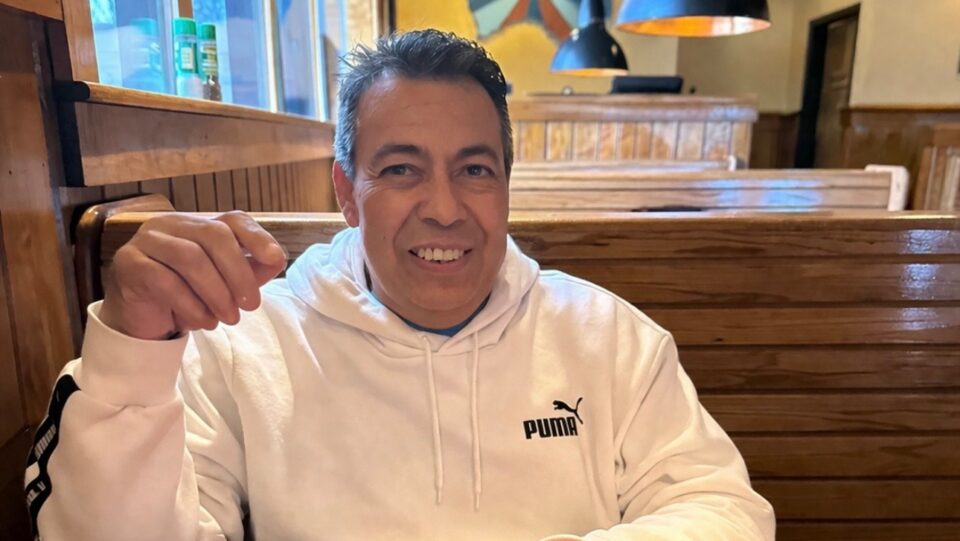 BMC Brighton patient Trinidad Barrios smiles as he sits at a restaurant table