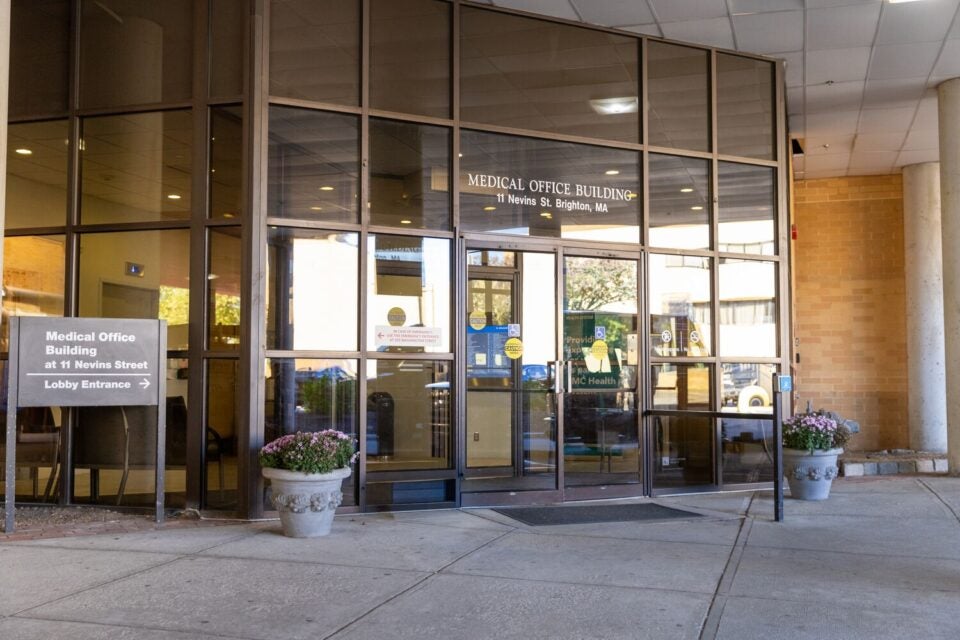 11-nevins-medical-office-building-entrance Exterior of the 11 Nevins Street entrance, a glass wall/doors with interior foyer visible, on the ground floor of a large office building.