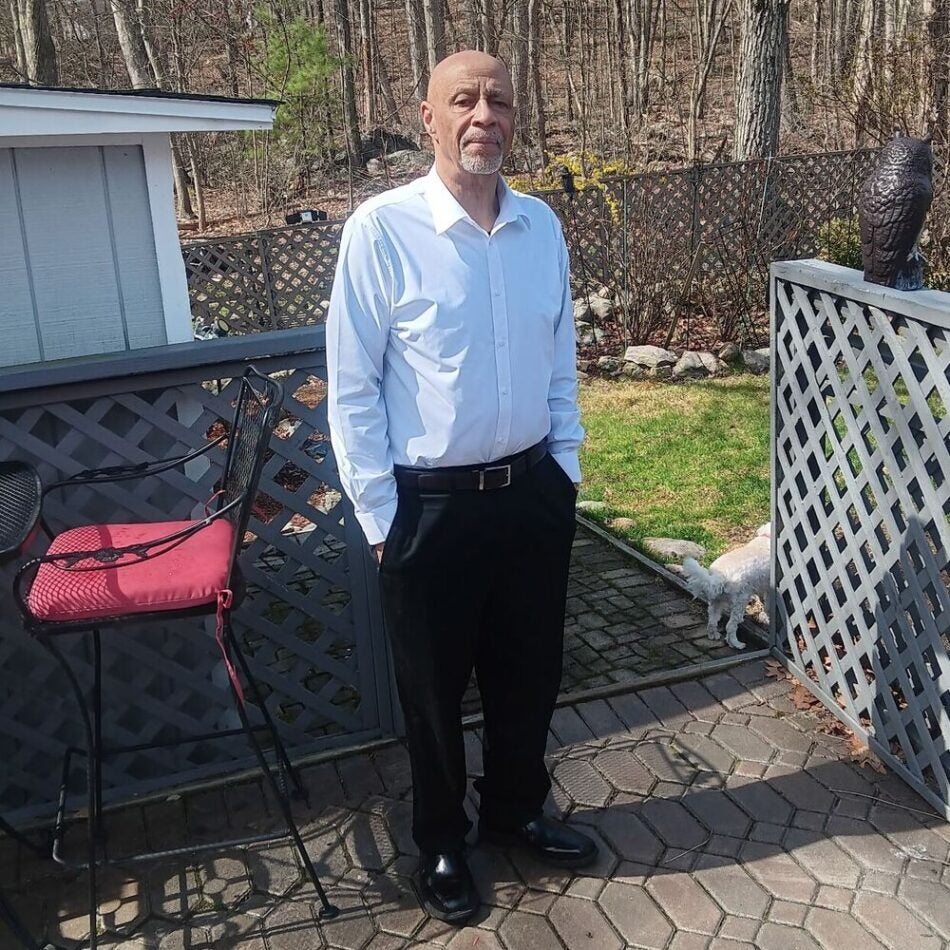 BMC and BMC Brighton esophageal cancer patient Stanley Mattox stands in his yard on a sunny day