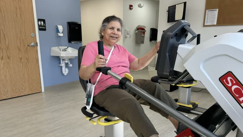 BMC Brighton cardiovascular patient Ruma uses exercise equipment as part of her rehabilitation