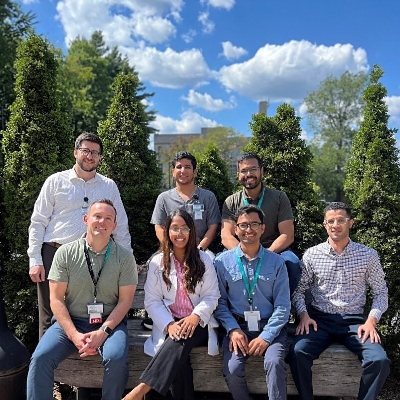 BMC Brighton pulmonary and critical care medicine fellows (group photo outdoors with trees and a sunny blue sky in the background)
