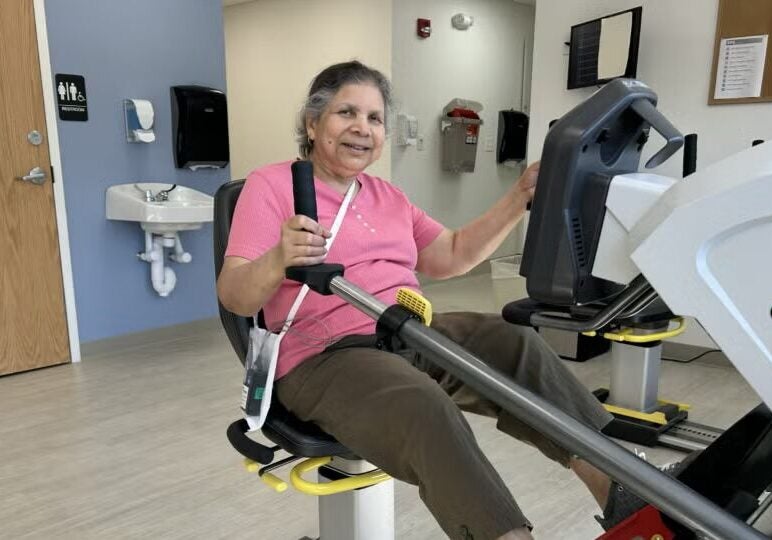 BMC Brighton cardiovascular patient Ruma uses exercise equipment as part of her rehabilitation